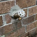Replacing a hose bib in Hanahan with mortar patch.