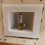 Installing an ice maker valve with hammer arrestor.