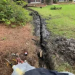 This is what a main water line replacement looks like in Summerville. Very narrow trench but it will take time for the grass to grow back, we're plumbers, not landscapers.