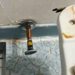 Installing a toilet supply stop on copper pipe. Yes we still solder sometimes.