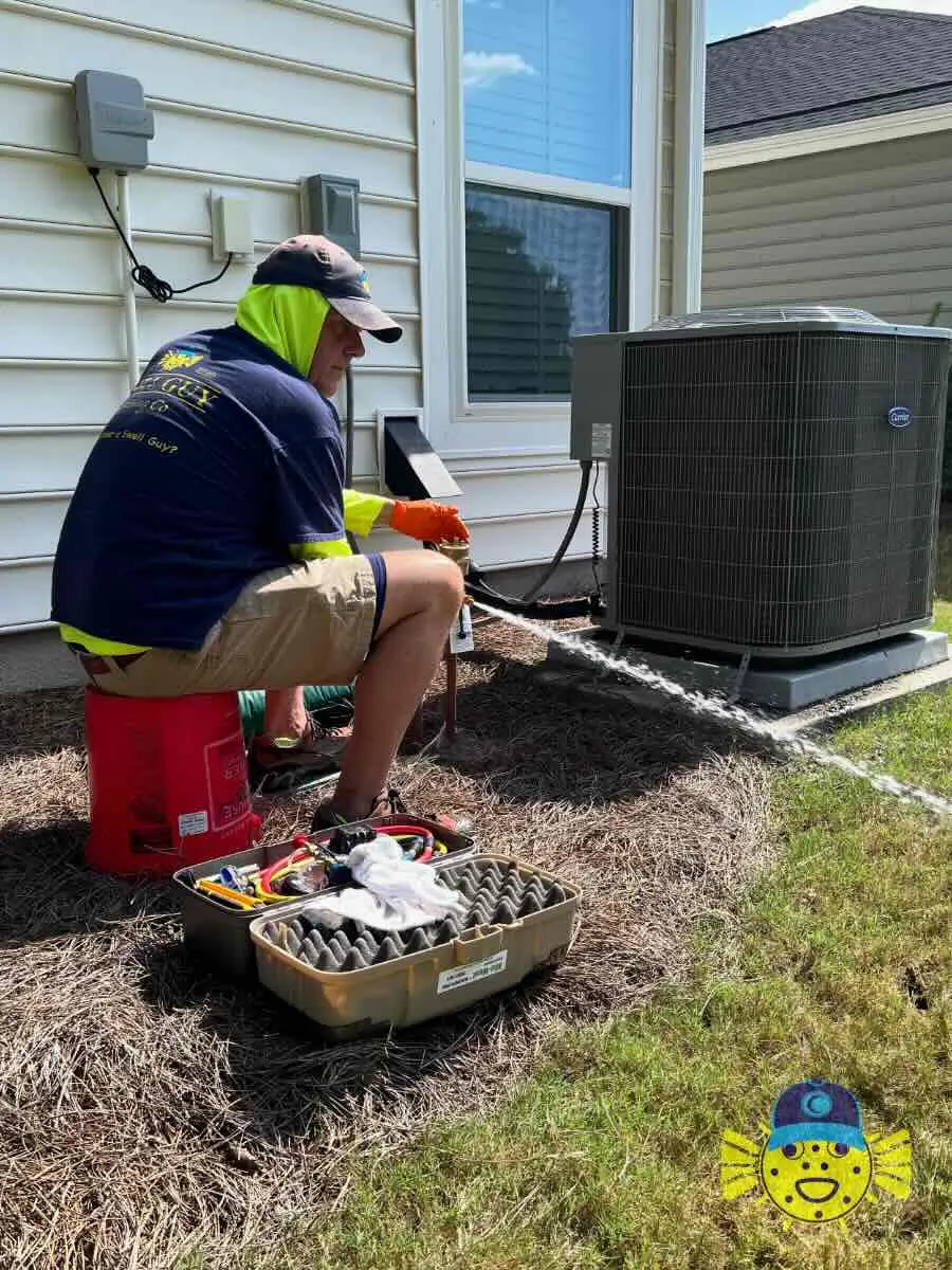 Swell Guy Plumbing technician performing a backflow preventer test outside a home in Summerville, SC.