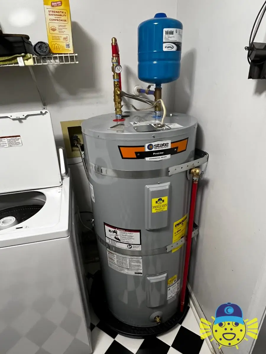 Newly replaced State ProLine electric water heater with a blue expansion tank and booster pump setup in a utility room in Hanahan, SC — Swell Guy Plumbing Co.