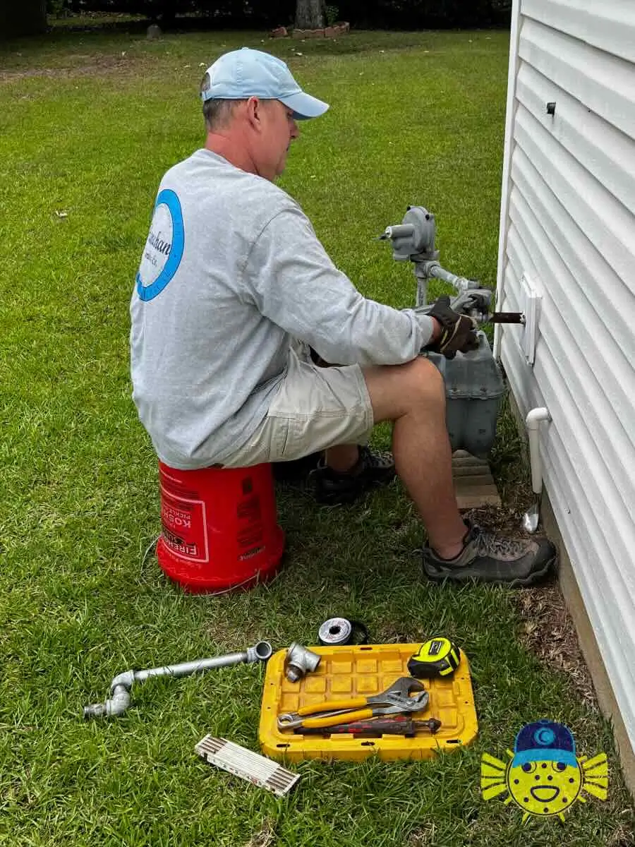 Swell Guy Plumbing technician performing exterior gas line repair on a residential home in Goose Creek, SC.