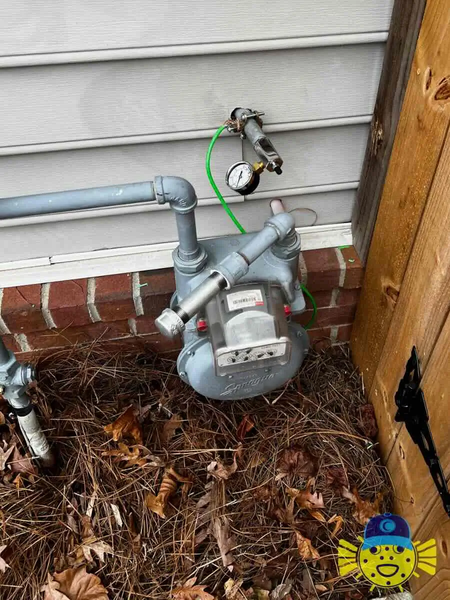 Gas meter undergoing a safety pressure test using a pressure gauge, performed by Swell Guy Plumbing in North Charleston, SC.