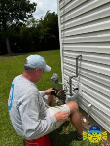 Swell Guy Plumbing technician working on exterior natural gas line repair in Goose Creek, SC