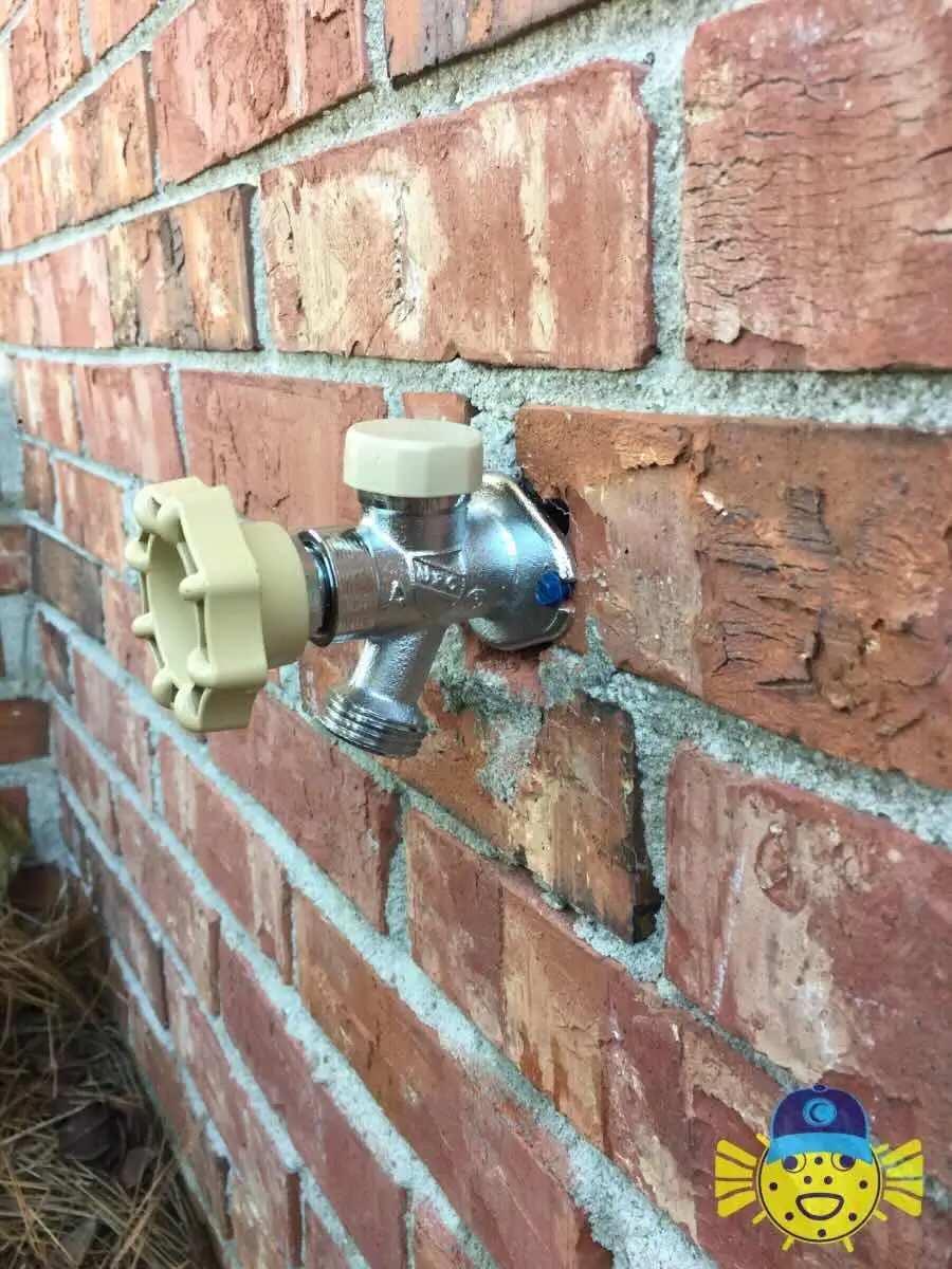 Newly installed outdoor hose bib outdoor spigot replacement on a brick home exterior in Goose Creek, SC by Swell Guy Plumbing.