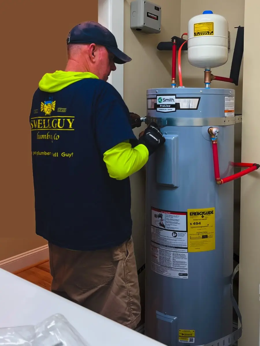Swell Guy Plumbing technician installing seismic straps on an AO Smith water heater in Charleston, SC.