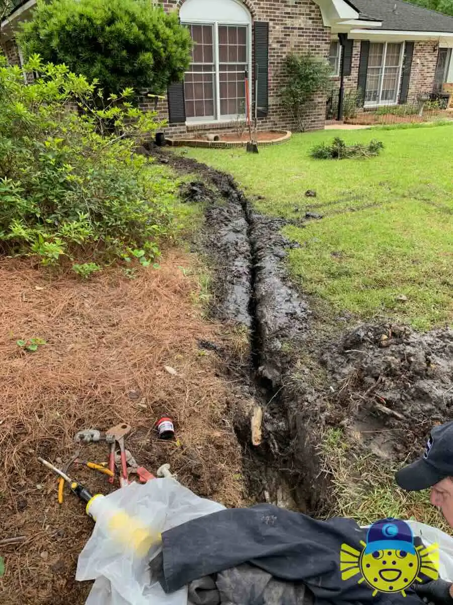 Main water line replacement trench in a residential lawn completed by Swell Guy Plumbing in Summerville, SC.