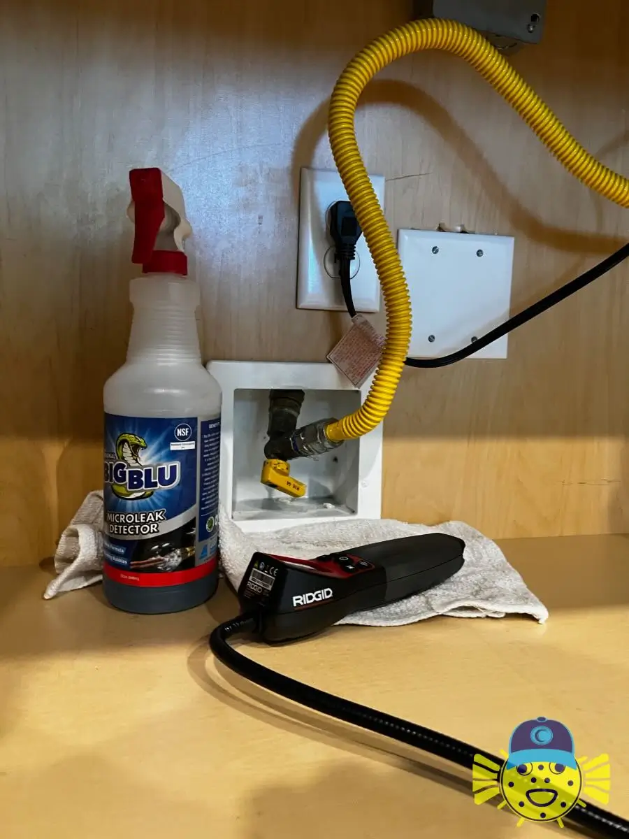 Swell Guy Plumbing natural gas leak detection tools set up near a yellow gas supply line.