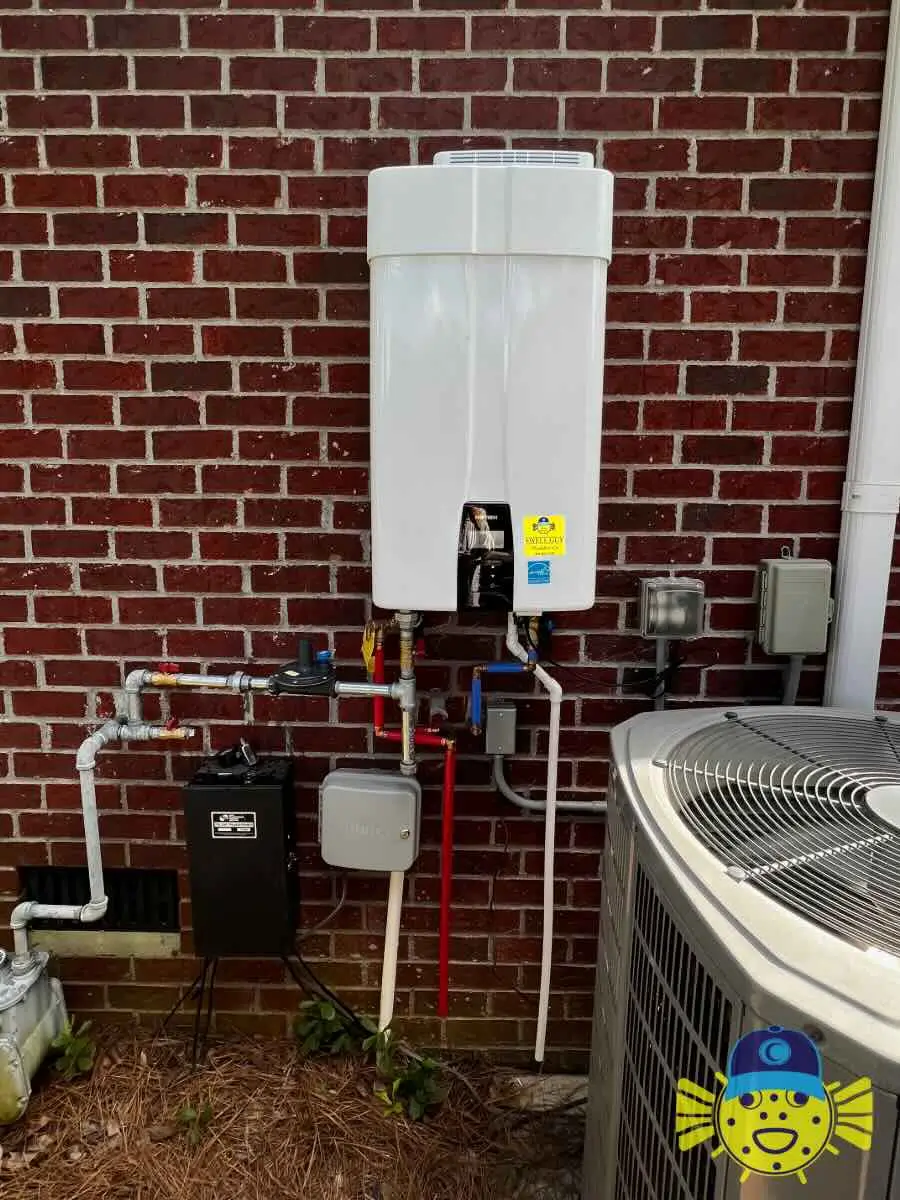 Newly installed tankless water heater mounted on an exterior red brick wall by Swell Guy Plumbing in Goose Creek, SC.