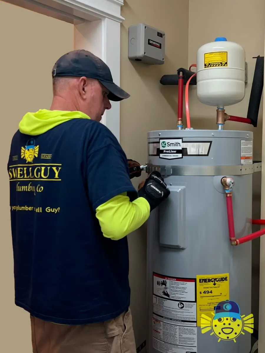 Plumber from Swell Guy Plumbing installing metal seismic straps on an A. O. Smith water heater in Charleston, SC.