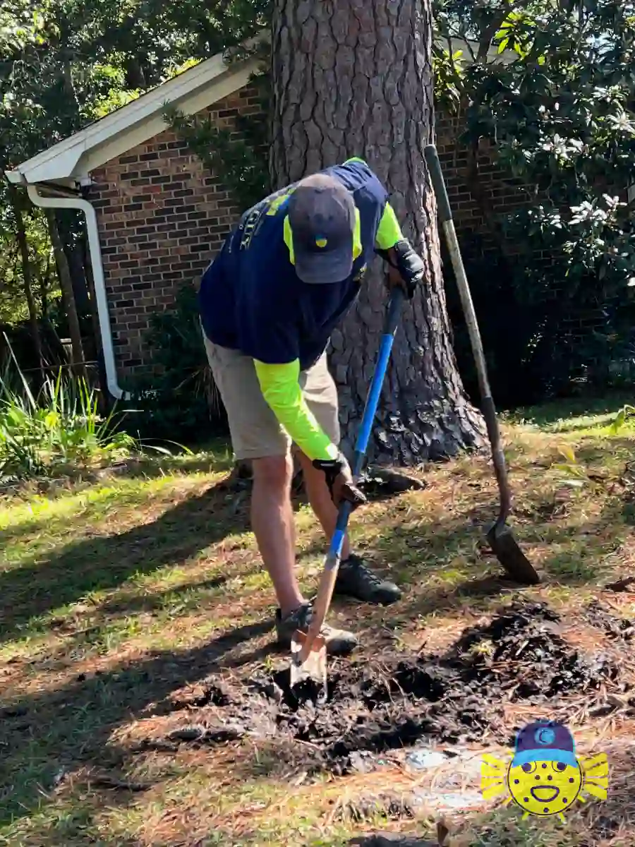 Swell Guy Plumbing technician digging a trench to access a damaged water line in Summerville, SC.